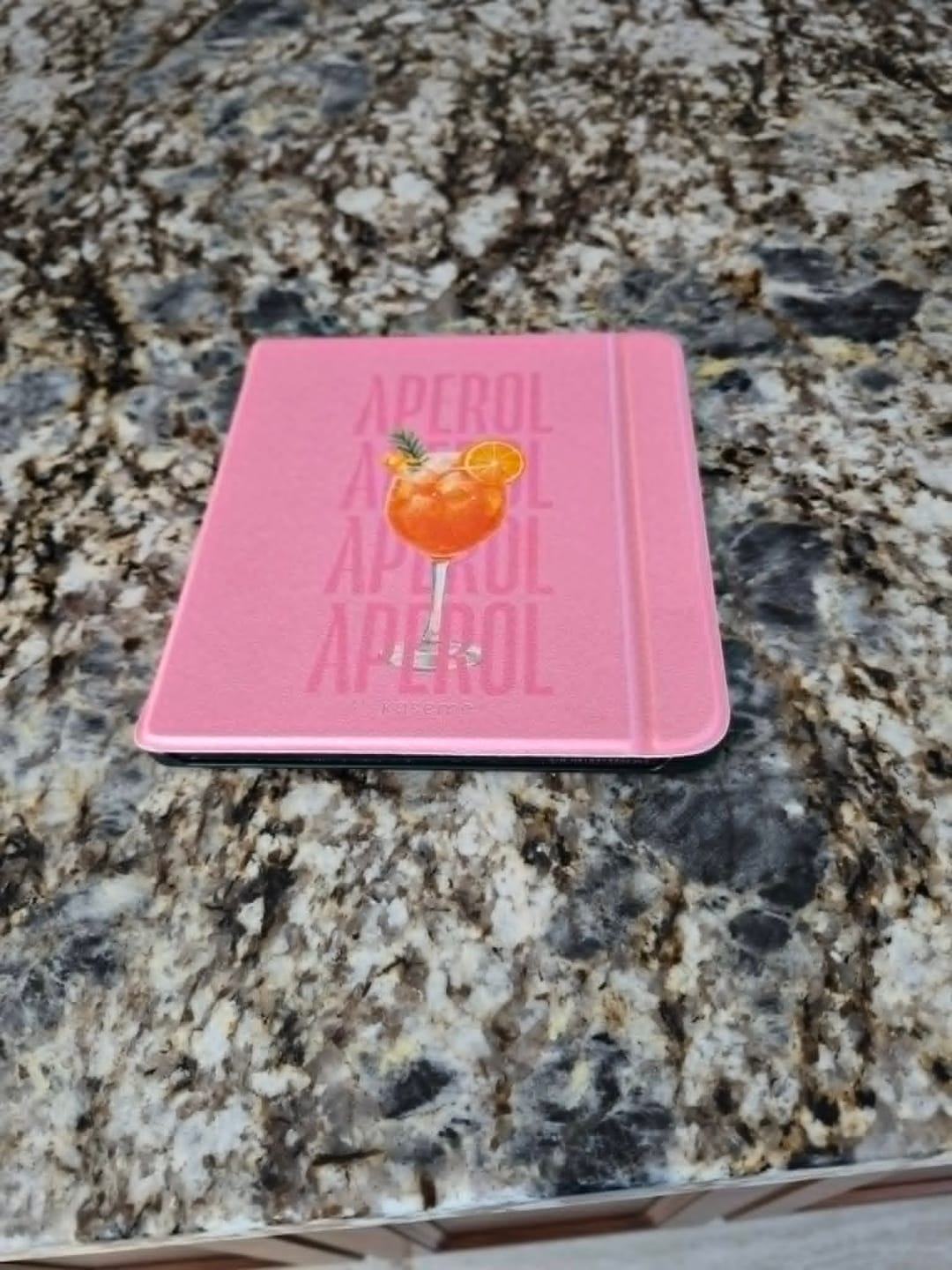 Customer photo review of Aperol Sunset Pink E-Reader Case