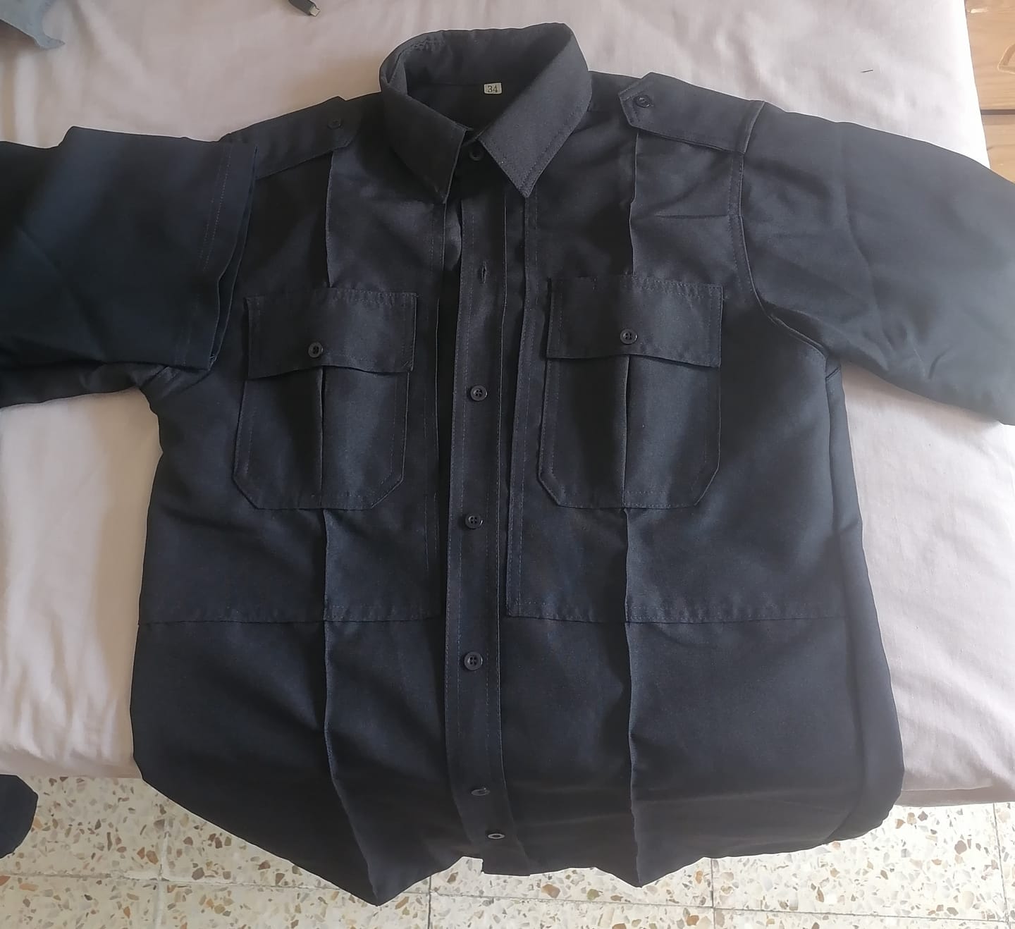 Customer photo review of Camisa Táctica Uniforme Azul y Blanco Policía Botones Simulados