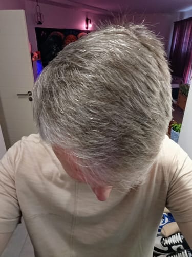Customer's grey hair after using the Pureology Hydrate Bundle, looking smooth and healthy.