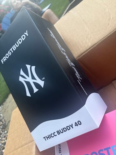 Customer's Thicc Buddy 40oz New York Yankees box, sitting on a shipping container.