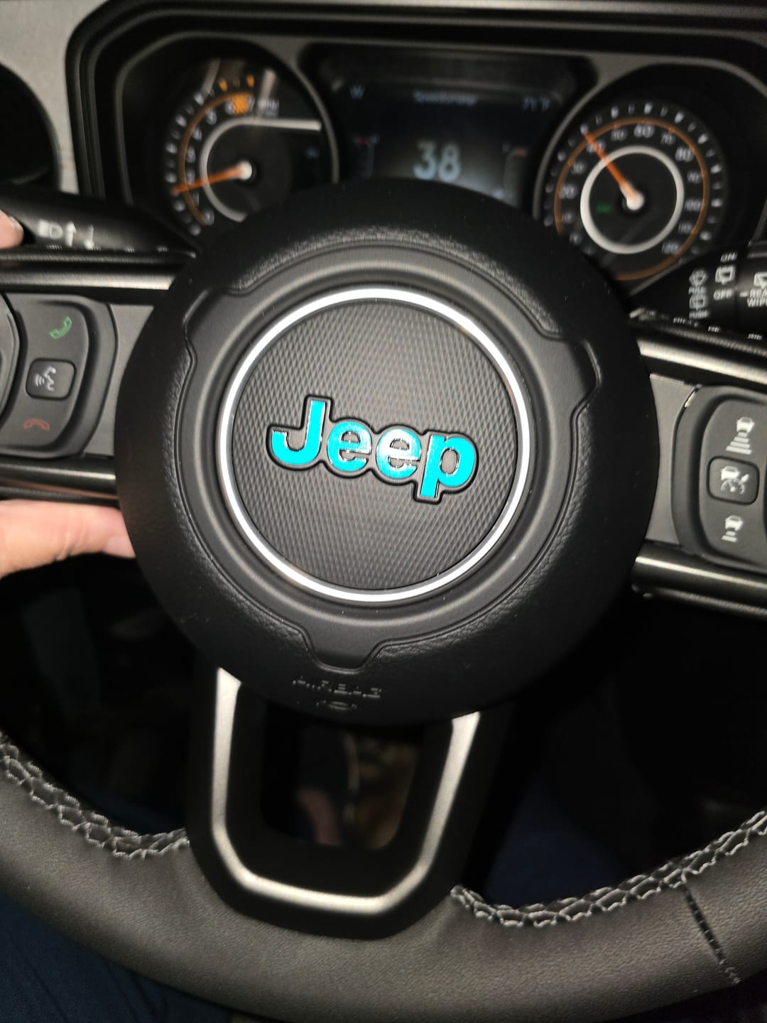 Customer photo review of JEEP Steering Wheel Emblem Overlay Decal — 30+ Colors & Designs (Flag, Topo, Animal, Solid)