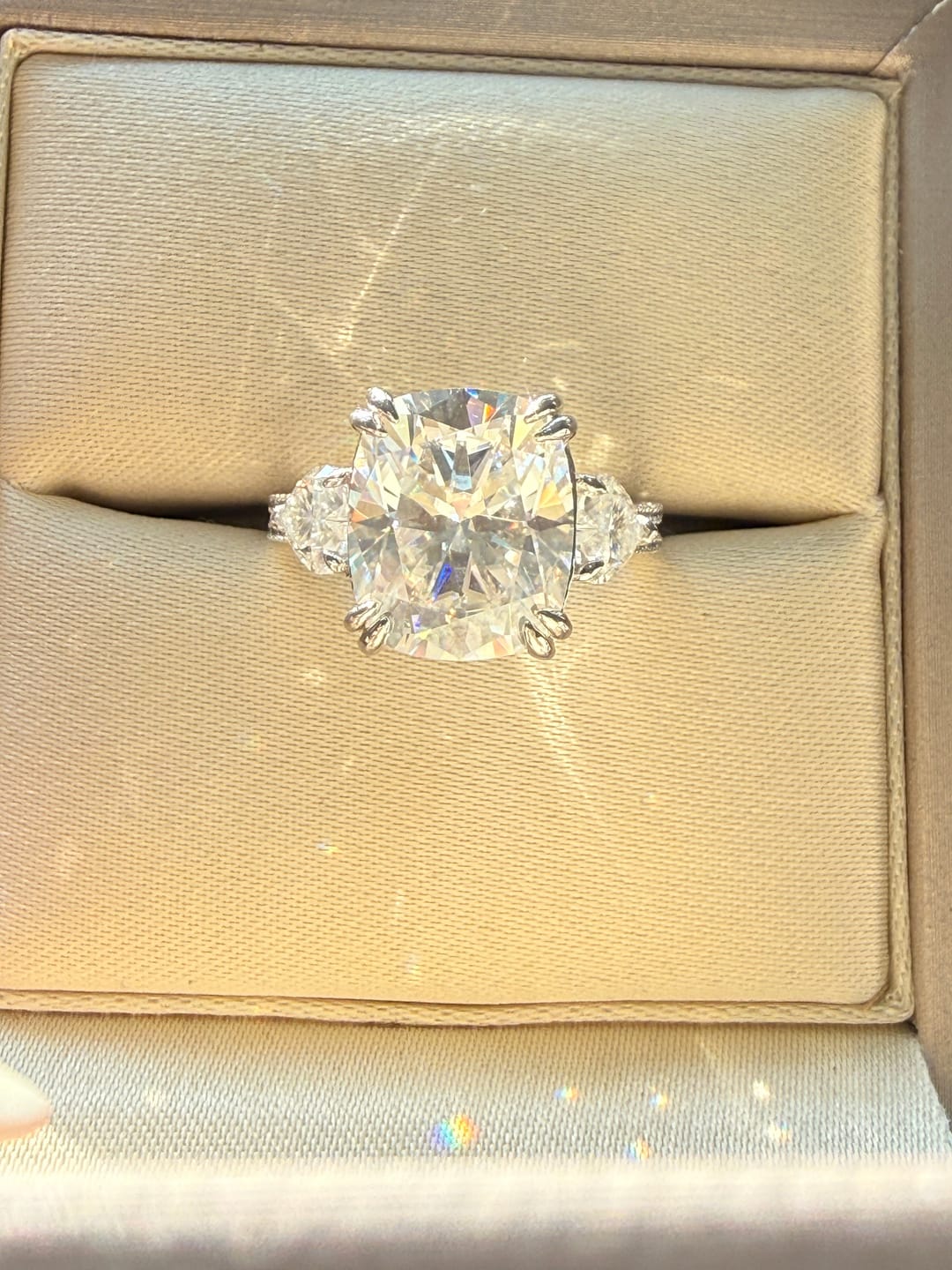Customer photo review of Moissanite 6.0Ct Cushion Cut Three Stone Engagement Ring In Sterling Silver