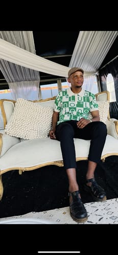 Customer's LFN007 knit top in beige and green, worn by a person seated on a decorative chair.
