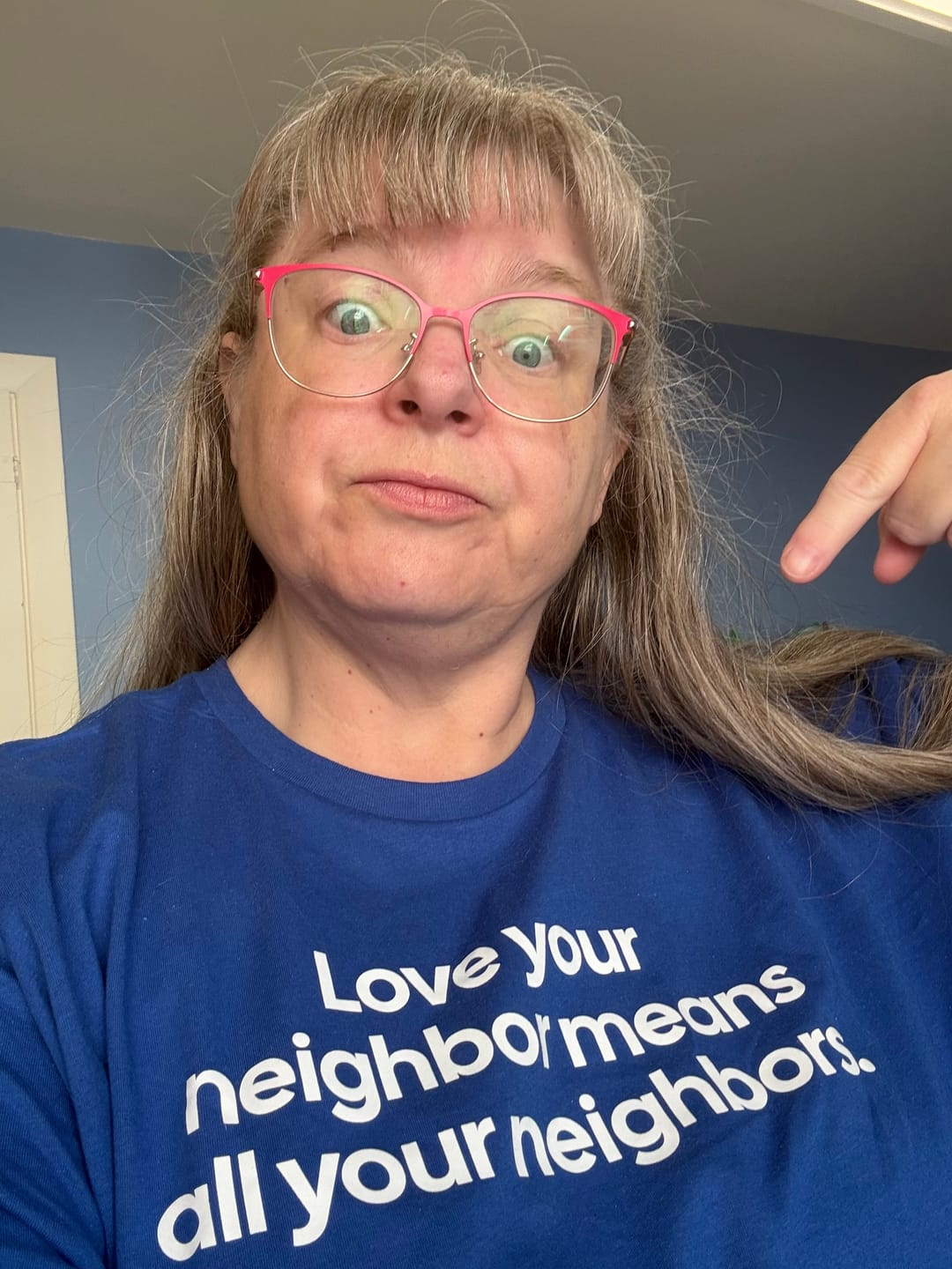 Customer photo review of Love Your Neighbor Means All Your Neighbors Unisex Tee