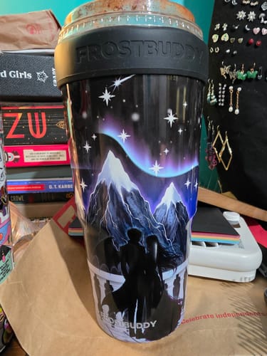Customer's Mystery To-Go Buddy featuring a night landscape design with a silhouetted couple under a starry sky.