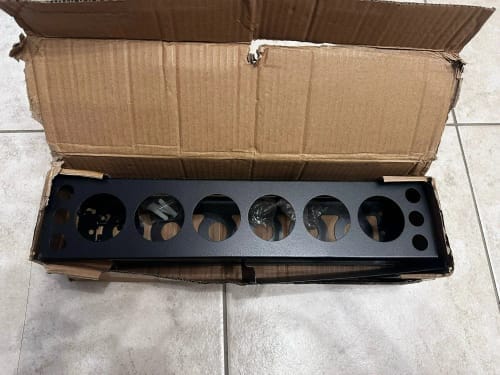 Customer photo review of Caulking Gun Storage Rack - Wall-Mounted Sealant Holder