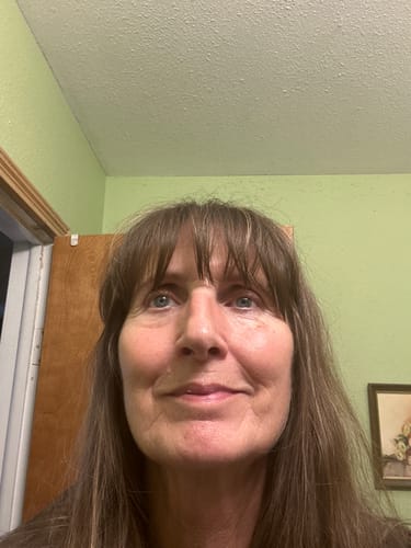 Customer's face showing results after using the Koriderm Time Reverse Cream, focusing on smooth skin around mouth area.
