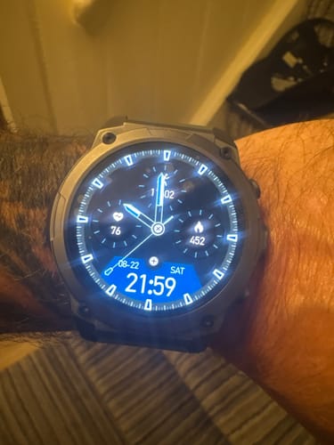 Customer's GardCare+ smartwatch with illuminated digital display worn on a person's wrist.