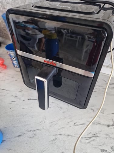 Customer's black Novio StonePro air fryer sitting on a kitchen counter.