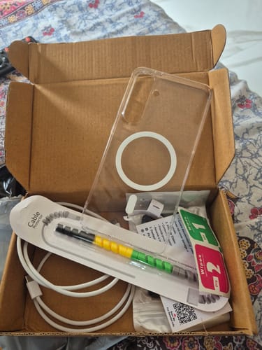 Customer's Anti Yellow Magsafe Clear Case for Samsung Galaxy S24 FE inside an open cardboard packaging box.