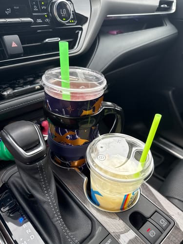Customer's To-Go Buddy cup insulator holding a drink in a car cup holder