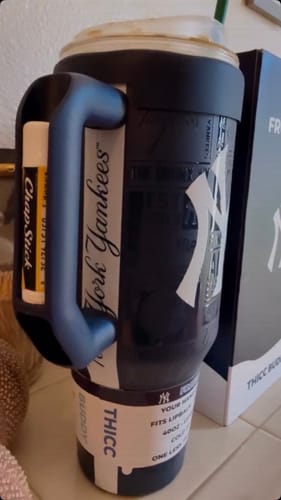 Customer's dark blue New York Yankees Thicc Buddy cup with chapstick in the handle.
