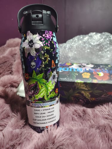 Customer's Bottle Buddy in Toxic Bloom floral print, showing botanical and skull patterns.
