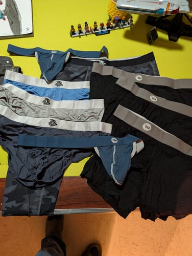 Customer's Mega Value Mystery Pack underwear selection, including briefs and jocks in assorted colors and styles.