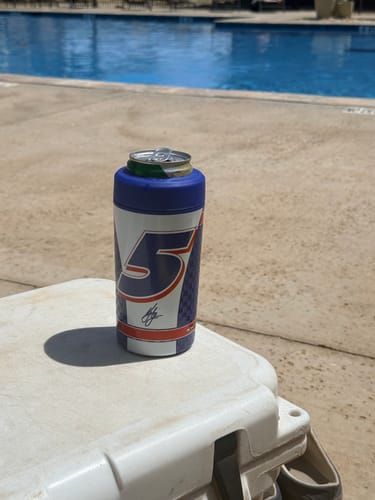 Customer's Universal Buddy can cooler featuring the number 5, resting on a white cooler by a swimming pool.