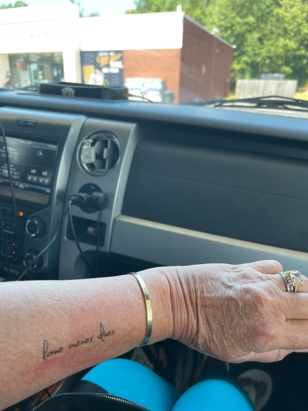 Customer photo review of Love Never Dies Tattoo