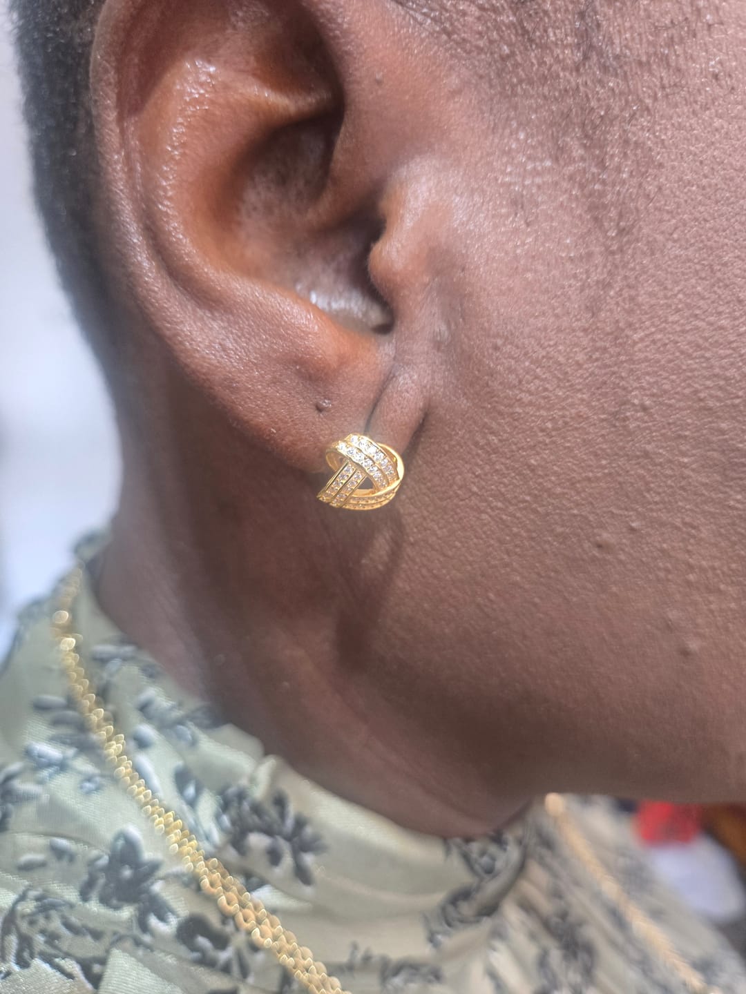 Customer photo review of Infinity Gold Stud Earrings