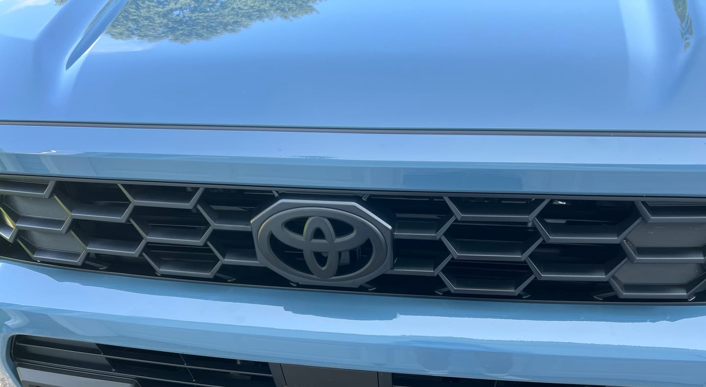 Customer photo review of NEW 2025-2026 4Runner Matte Blackout Overlay Front Grille Emblem