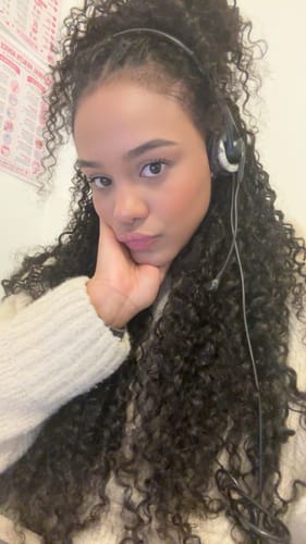 Customer's natural black Human Crochet Hair Water Wave installed, styled in a voluminous, curly look.