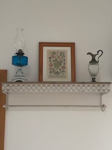 Customer's Simone French Provincial Wall Shelf, mounted on a wall and displaying a lamp, framed art, and a pitcher.