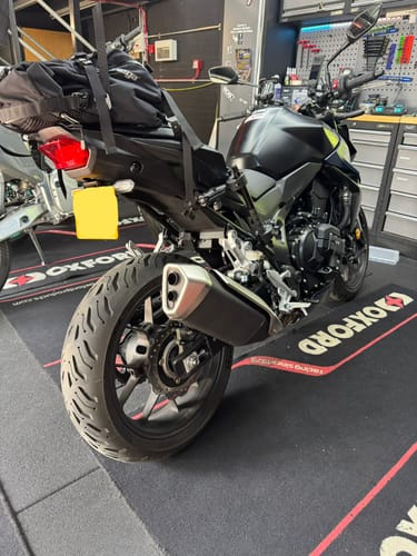 Customer's motorcycle at the studio following a Bracket Fitment Service, showing the plate and indicator setup.