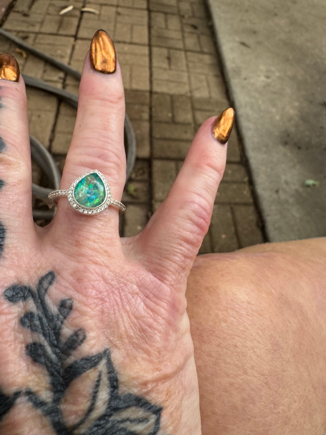Customer photo review of Bedazzled Pear Opal Ring with Cremation Ashes