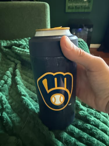 Customer's hand holding a dark blue Universal Buddy can cooler with the yellow Milwaukee Brewers logo