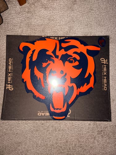 Customer's Chicago Bears Roaring Bear 3D vintage metal wall art on a black Hex Head cardboard shipping box.
