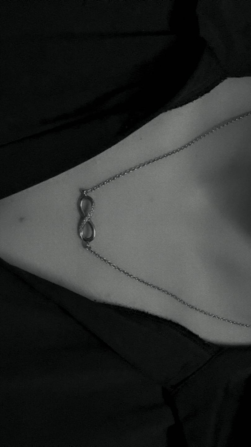 Customer photo review of Infinity Sign Necklace