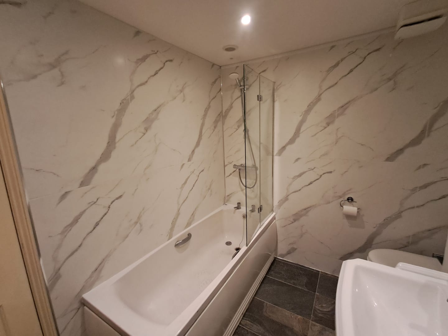 Customer photo review of 10mm Large Tile Carrara Marble Matt Shower Panel 1M x 2.4M