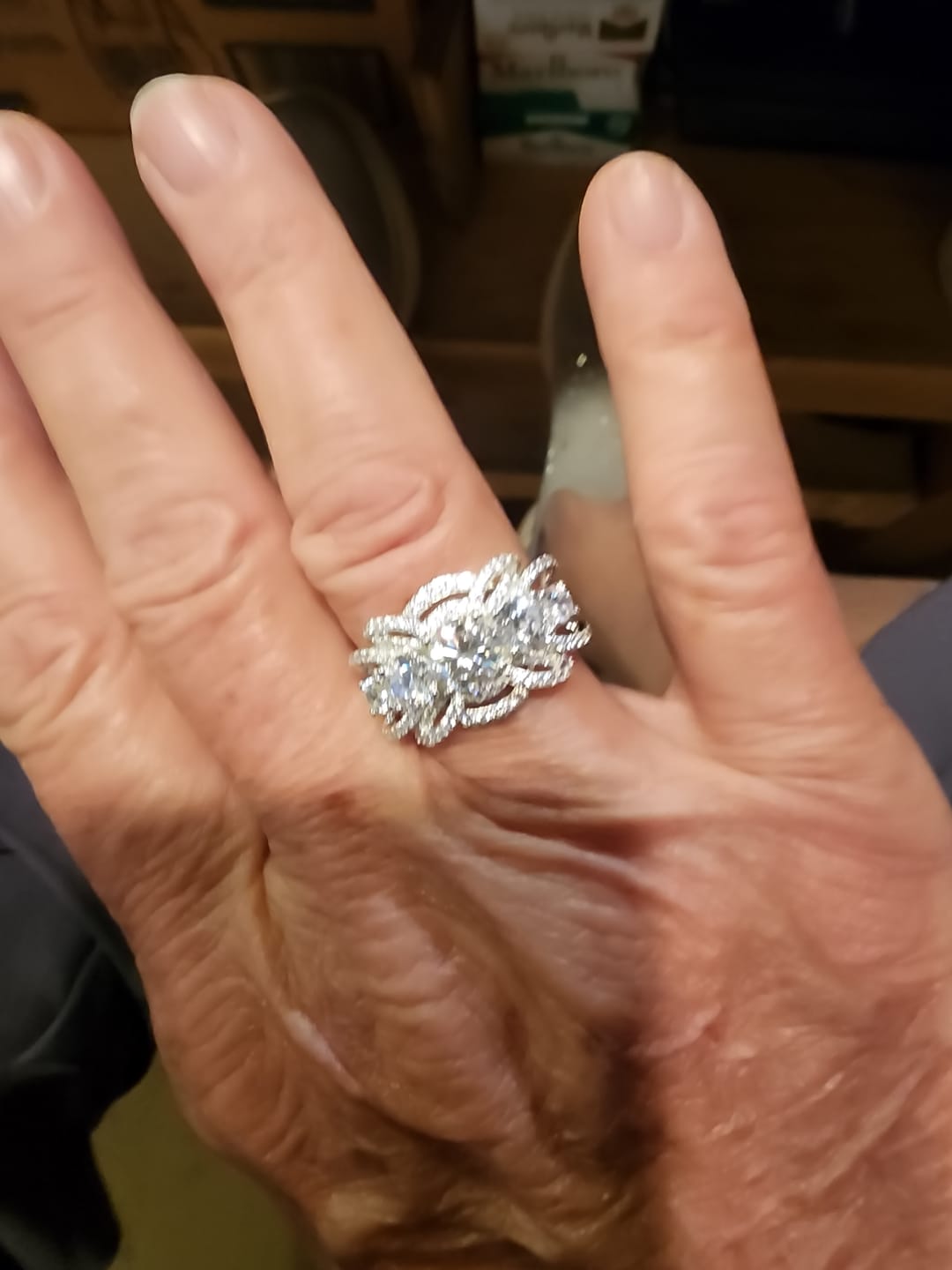 Customer photo review of Five Stone Round Moissanite Multi-Row Crossover Pave Engagement Ring