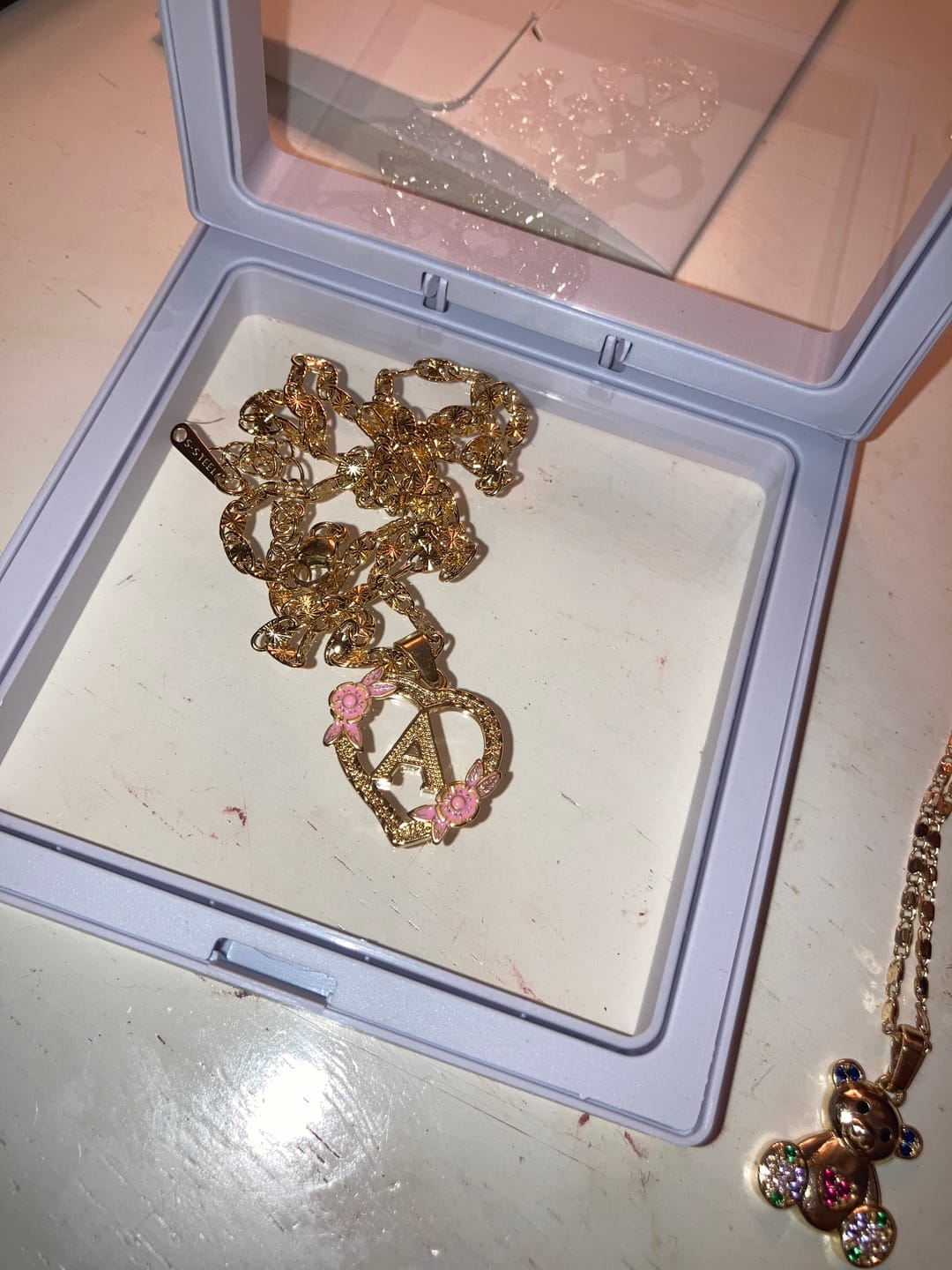 Customer photo review of Flower Initial Necklace w/ Clip Chain