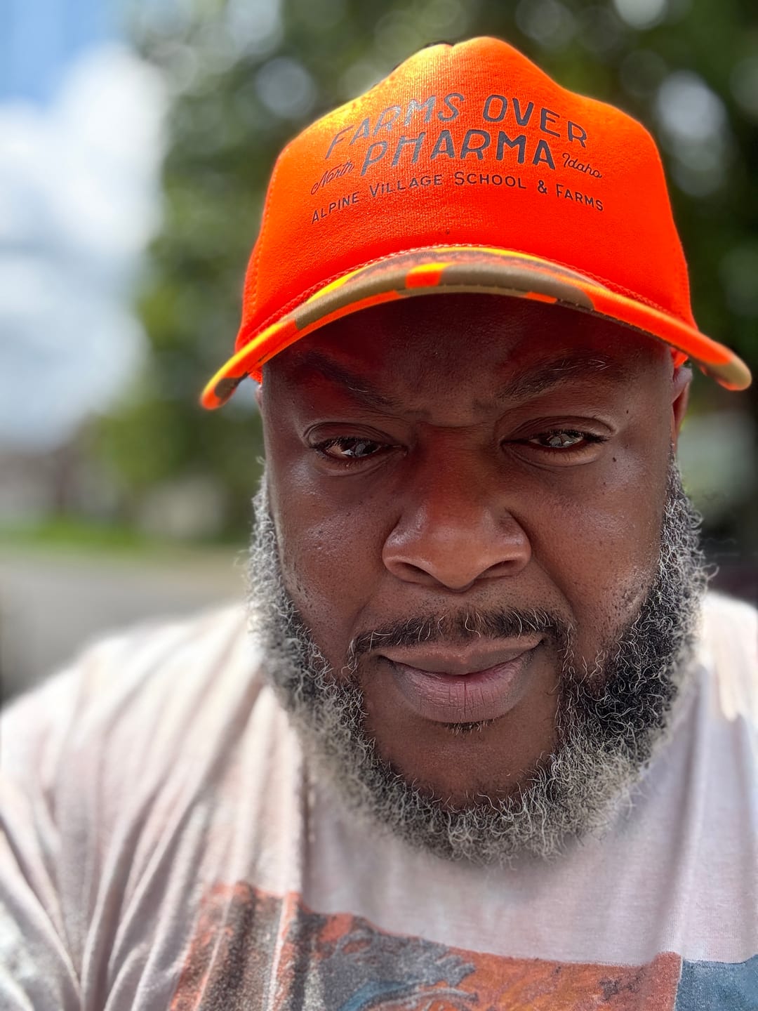 Customer photo review of Farms Over Pharma Trucker Hat (Neon Orange/Camo)