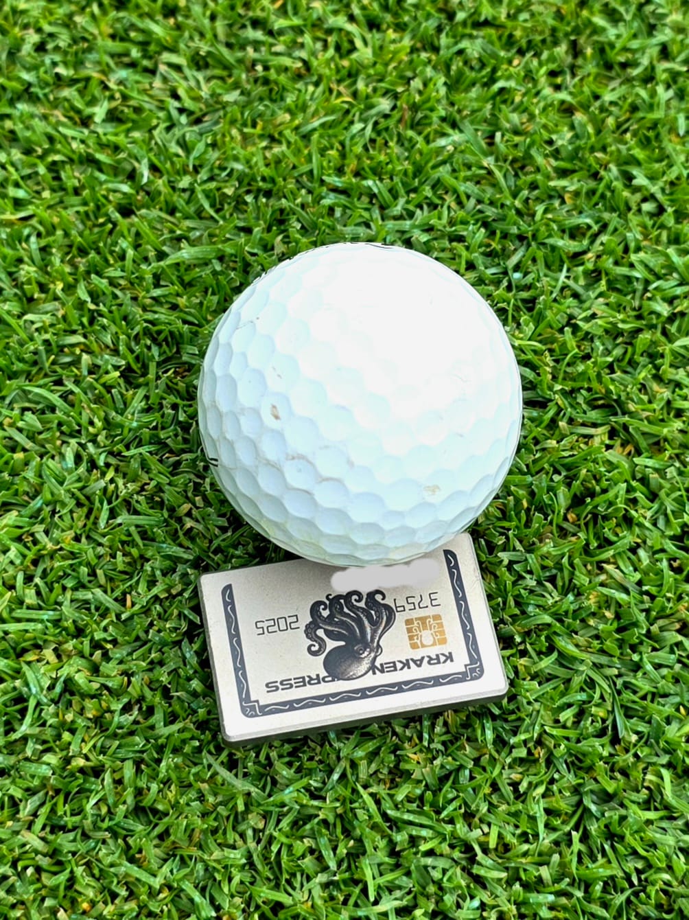 Customer photo review of The Silver Kraken Express Ball Marker | Kraken Titanium Golf Ball Marker