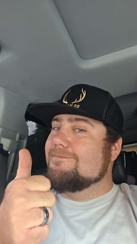 Customer's Hat of the Month Crew cap with gold antler logo design.