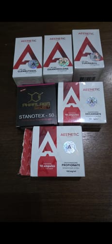 Customer's Aesthetic OxanX 10 boxes among other Aesthetic Labs supplements on a dark surface.