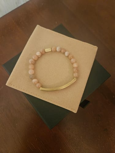 Customer's I CAN DO ALL THINGS THROUGH CHRIST bracelet featuring light earth stone beads and a gold-tone bar.