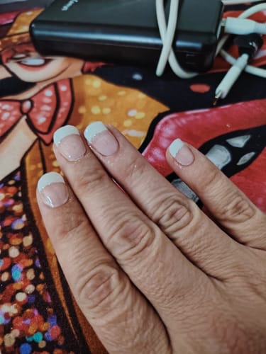 Customer's natural nails featuring a clean french manicure style from the Mix & Match Refill Bundle