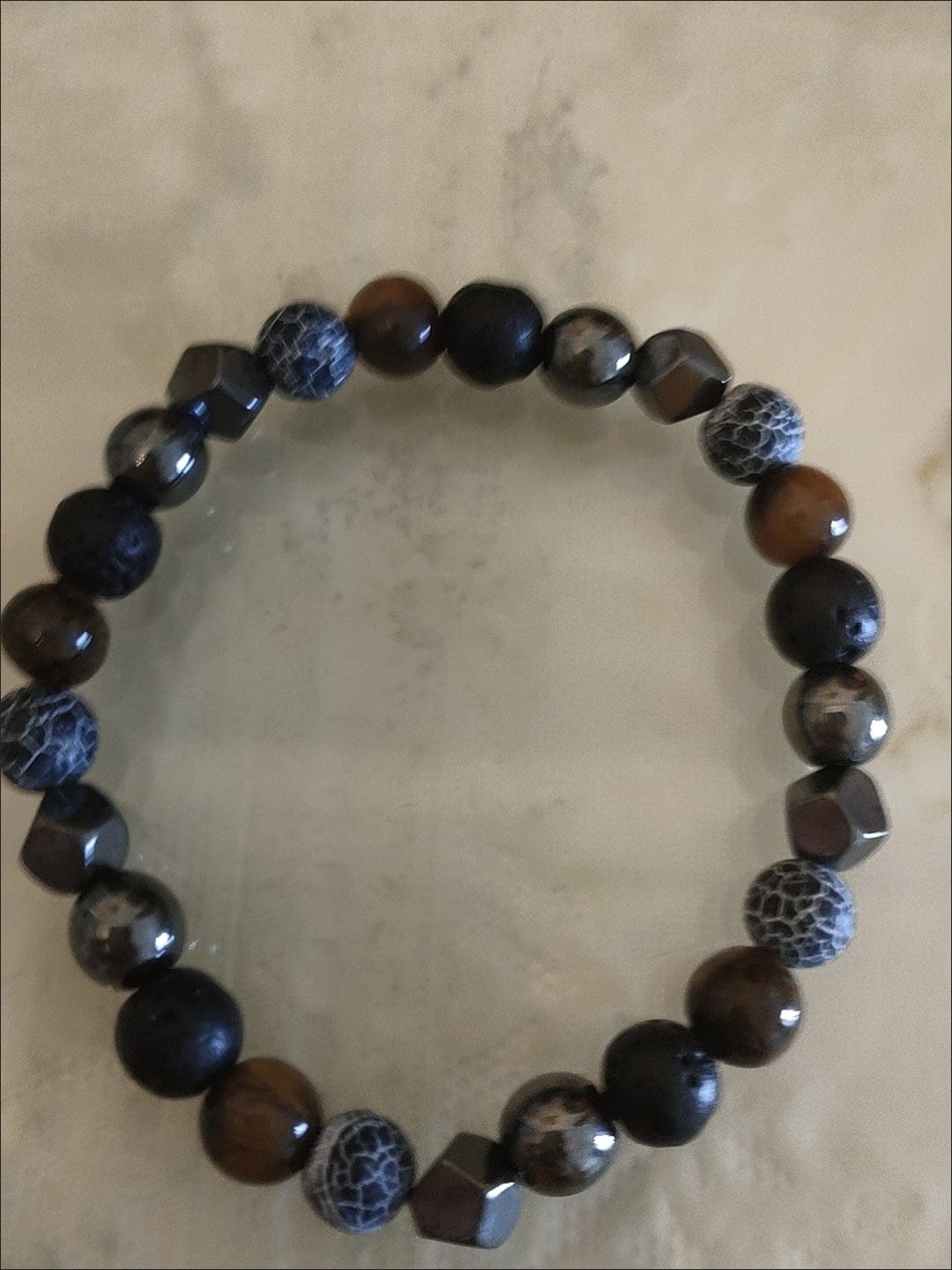 Customer photo review of FuAttract Protection Strength & Grounding Energy Tiger Eye Hematite Lava Stone Weathered Stone Money Bracelet