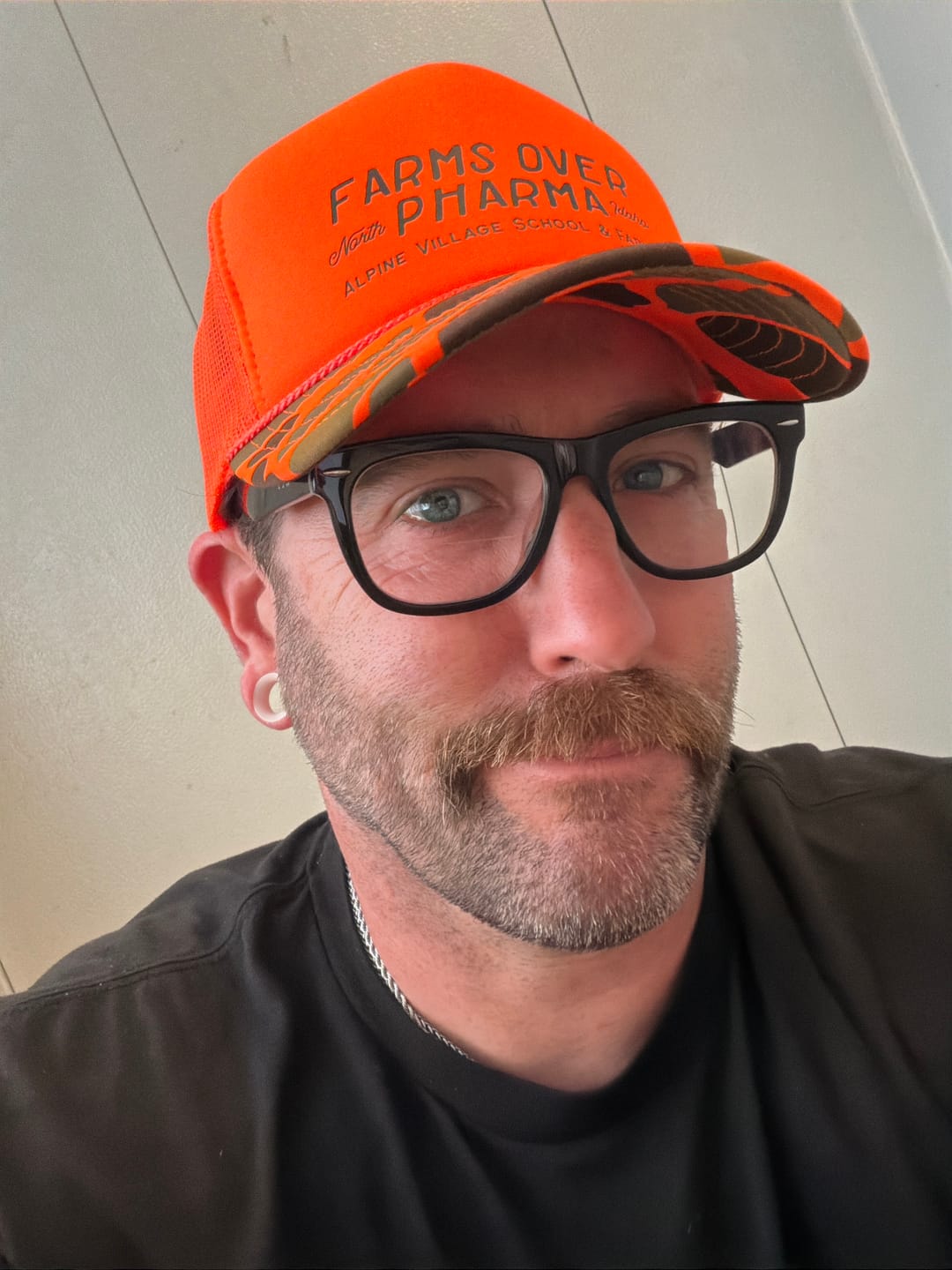 Customer photo review of Farms Over Pharma Trucker Hat (Neon Orange/Camo)