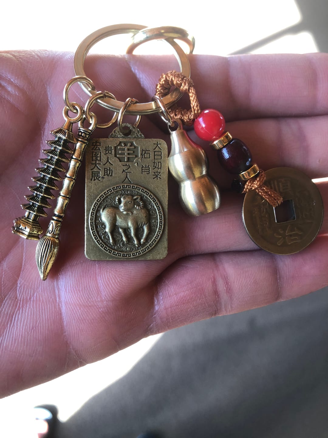 Customer photo review of FuAttract Wisdom Protection Chinese Zodiac Calabash Cinnabar Brass Keychain