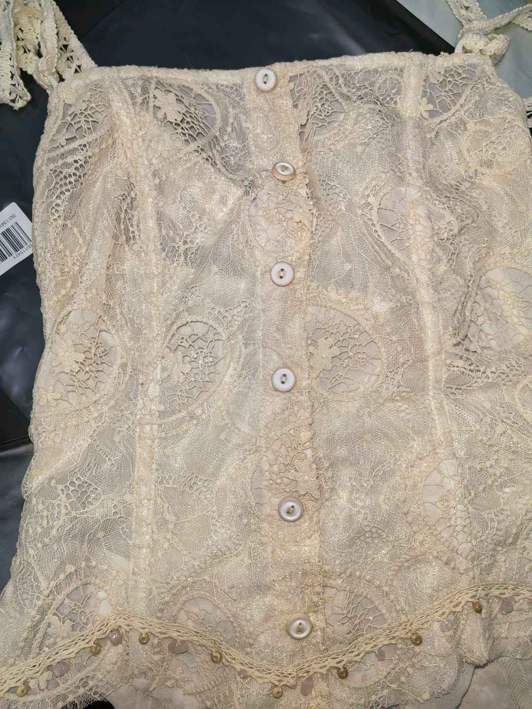 Customer photo review of DOINDULGE Antique Lace Corset Camisole Raw Edge Asymmetric Hem Top