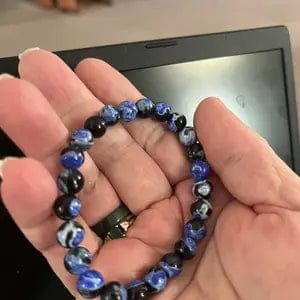 Customer photo review of FuAttract Calm Protection & Balance Blue Fire Agate Energy Bracelet