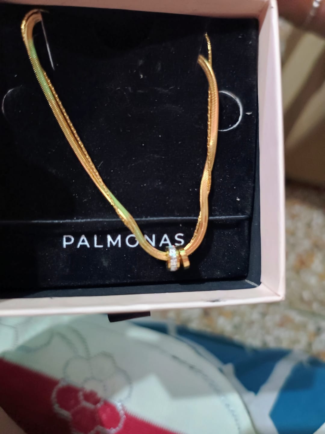 Customer photo review of Gilded Rings Layered Necklace