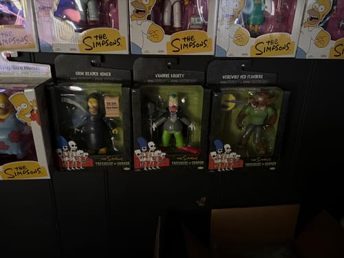 Customer's collection of The Simpsons Treehouse of Horrors action figures, including Vampire Krusty, displayed in boxes.