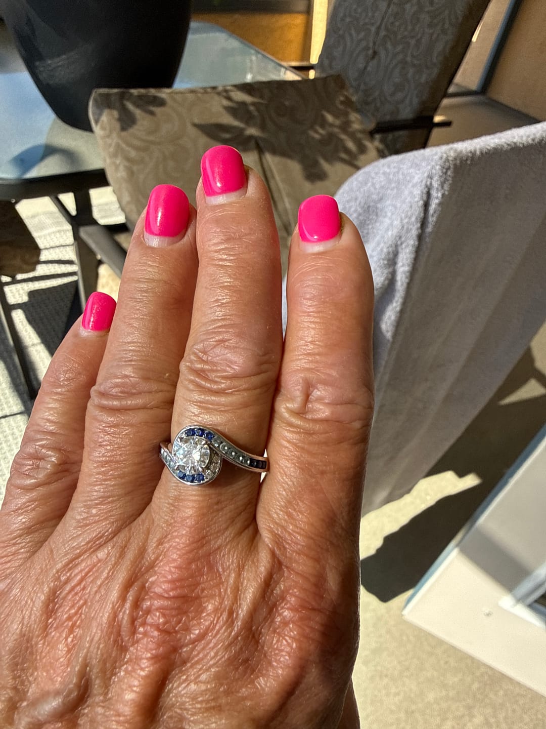 Customer photo review of Bypass Round Moissanite Gradient Ocean Blue Channel Set Engagement Ring