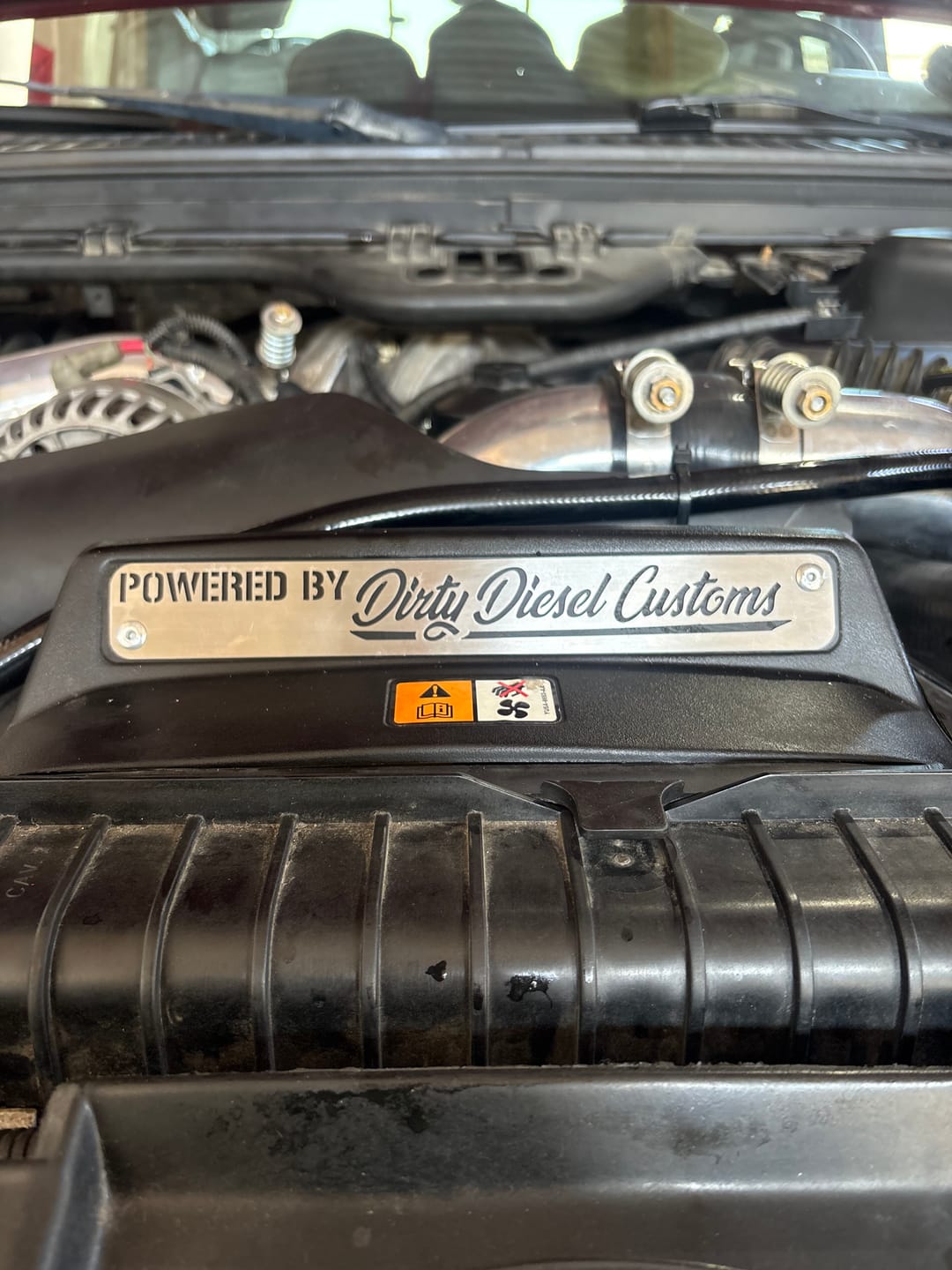 Customer photo review of Universal "Powered by Dirty" Engine Placard (060-ENG-A010)