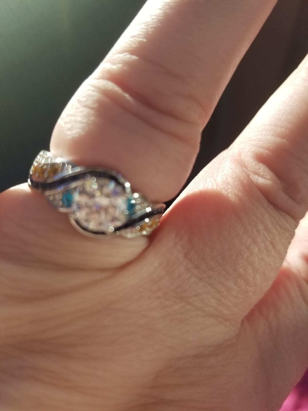 Customer photo review of Starry Night Moissanite Artistic Swirl Accent Engagement Ring