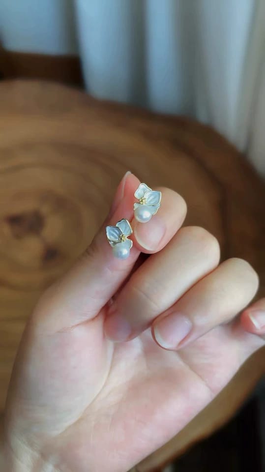 Customer photo review of Odette Mother-of-Pearl Orchid Stud Earrings