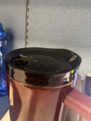 Customer's ONE Lid shown in a close-up view on a tumbler, featuring a black design.